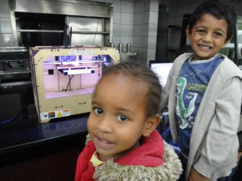Neema and Rohan enjoying their turn on the 3-D printer